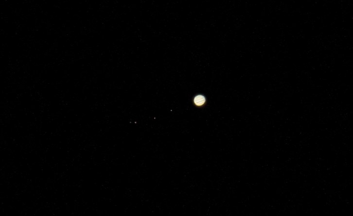 Jupiter, with its for primary satellites, the Gallilean Moons Io, Europa, Ganymede, and Callisto.