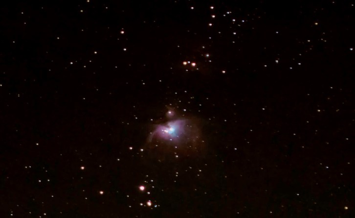 The Orion Nebula, one of the few intriguing deep sky objects visible to the naked eye, the second of three "stars" that make up Orion's Sword.