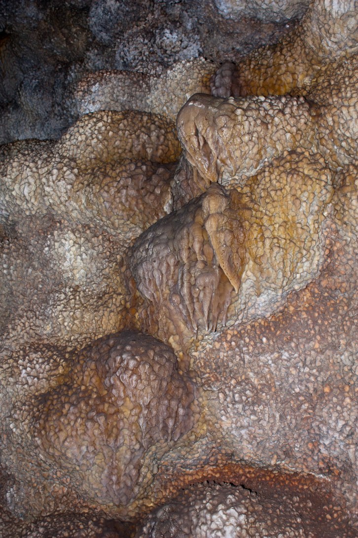 Jewel encrusted walls with the flowing beginnings of curtains forming around them.